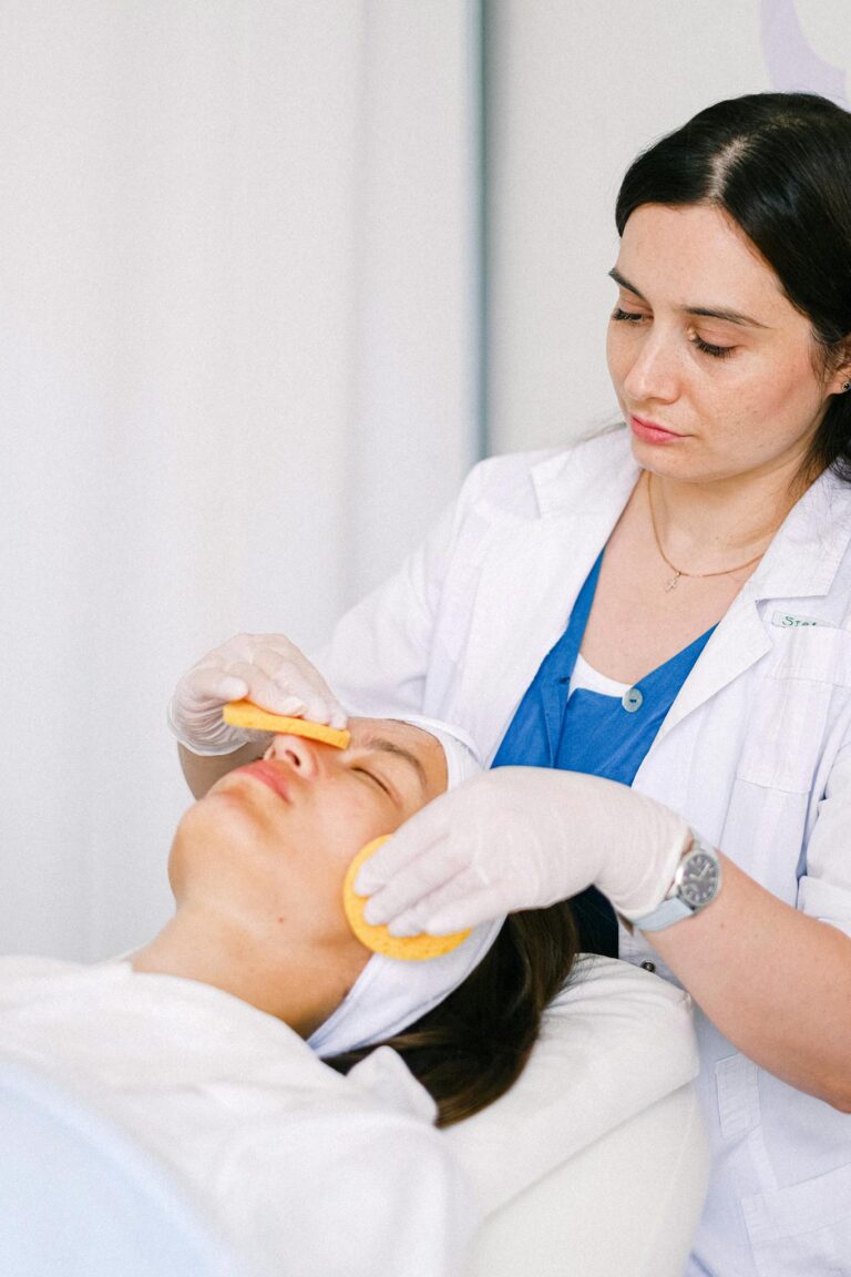 Cosmetologist performs a gentle facial process at a spa, ensuring client relaxation and skin rejuvenation.